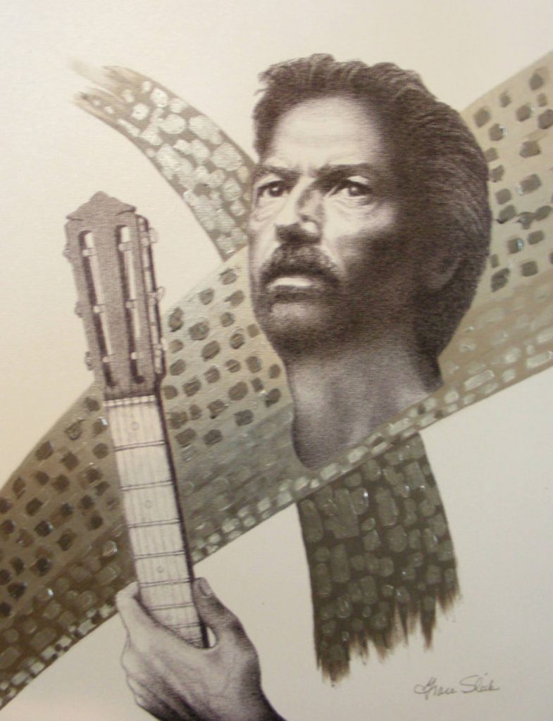 a man holding a guitar